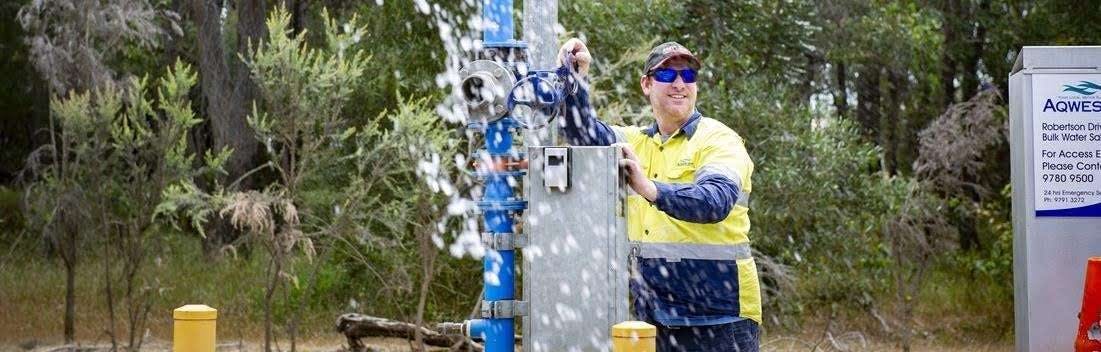 Man opening up bulk water installation.
