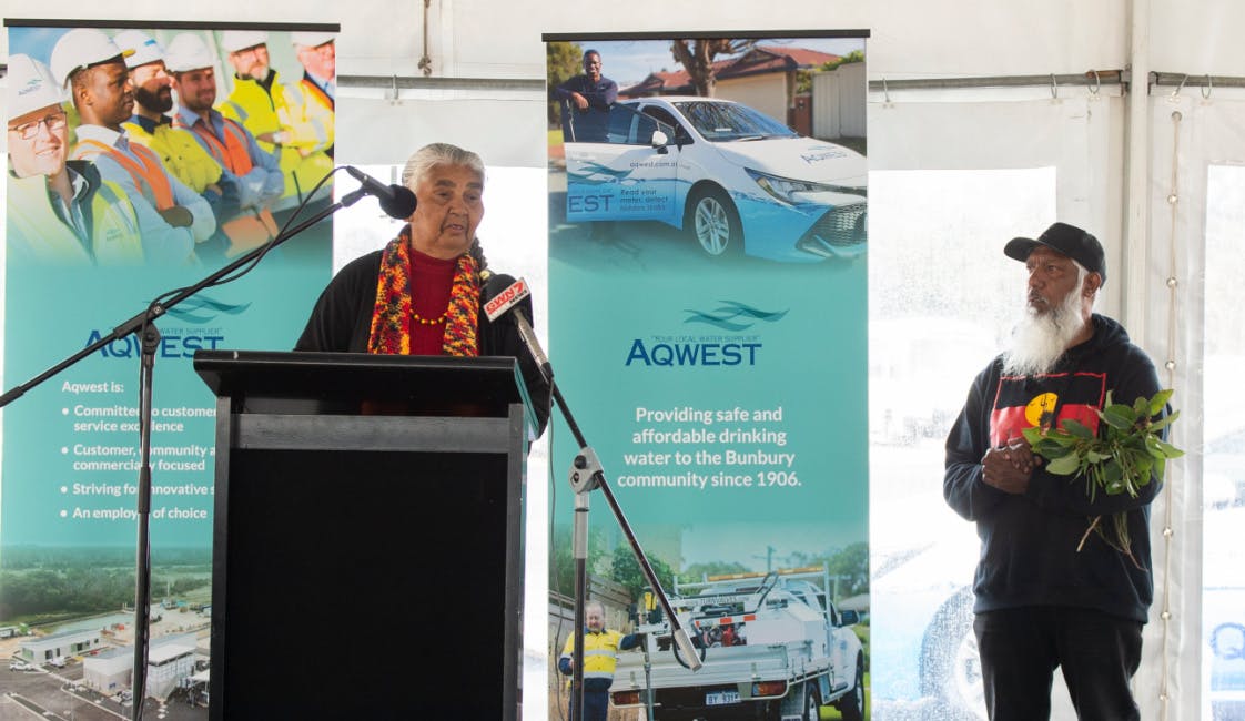 Aboriginal elders speaking at a podium