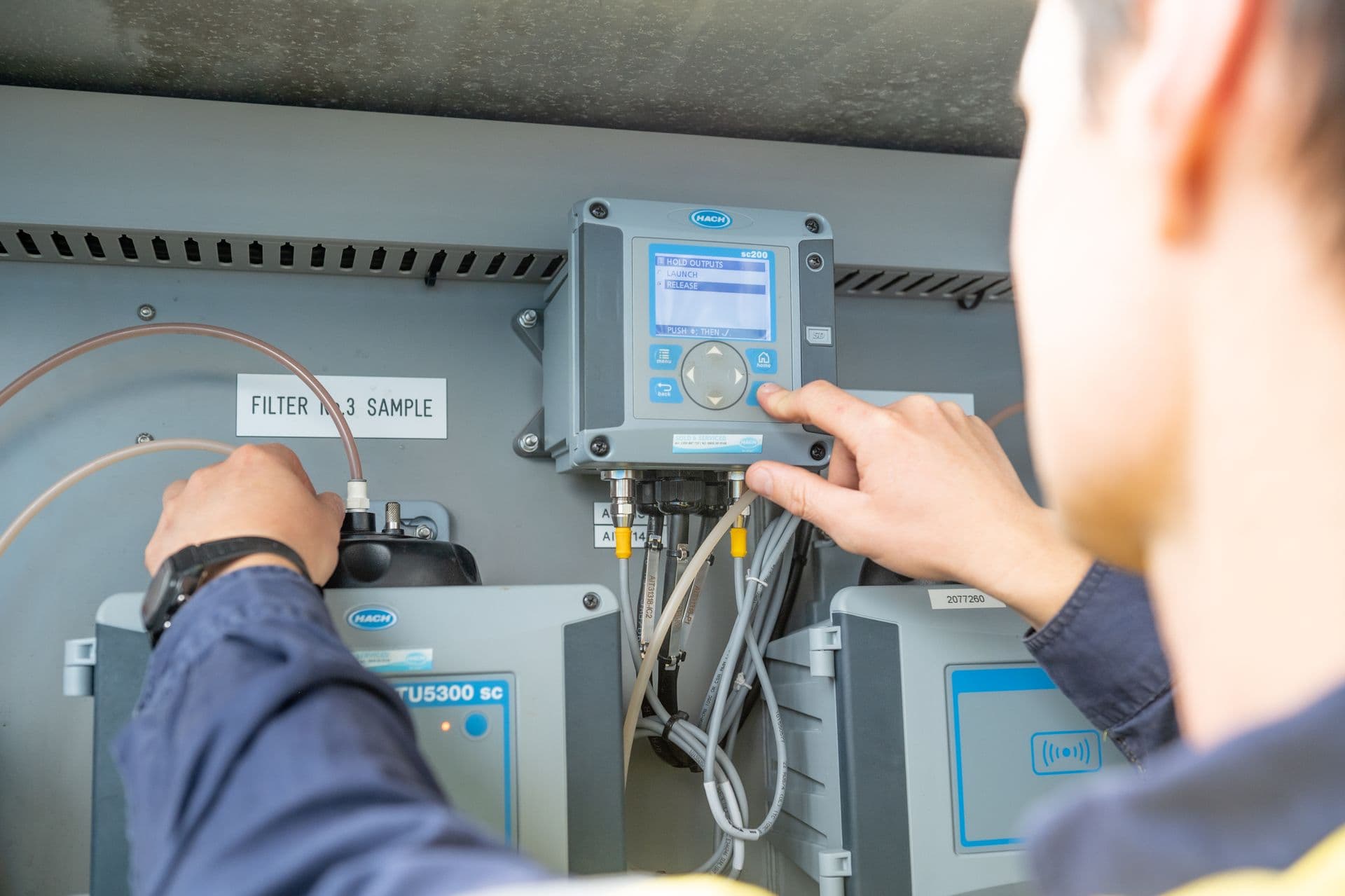 Person inspecting water filter