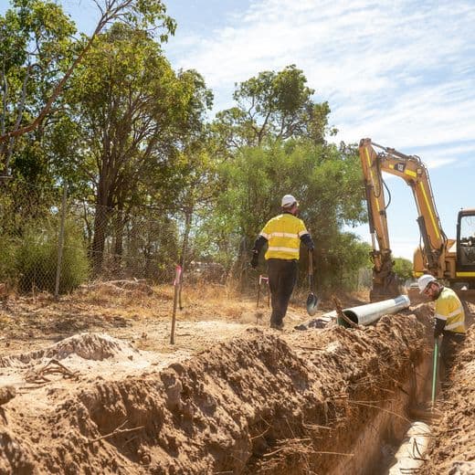 Men digging up earth