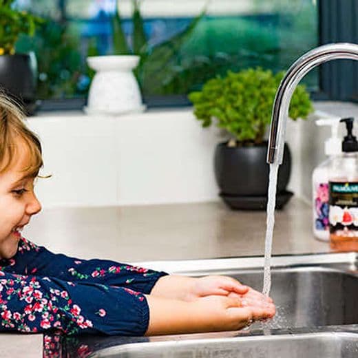 Kid washing hands.