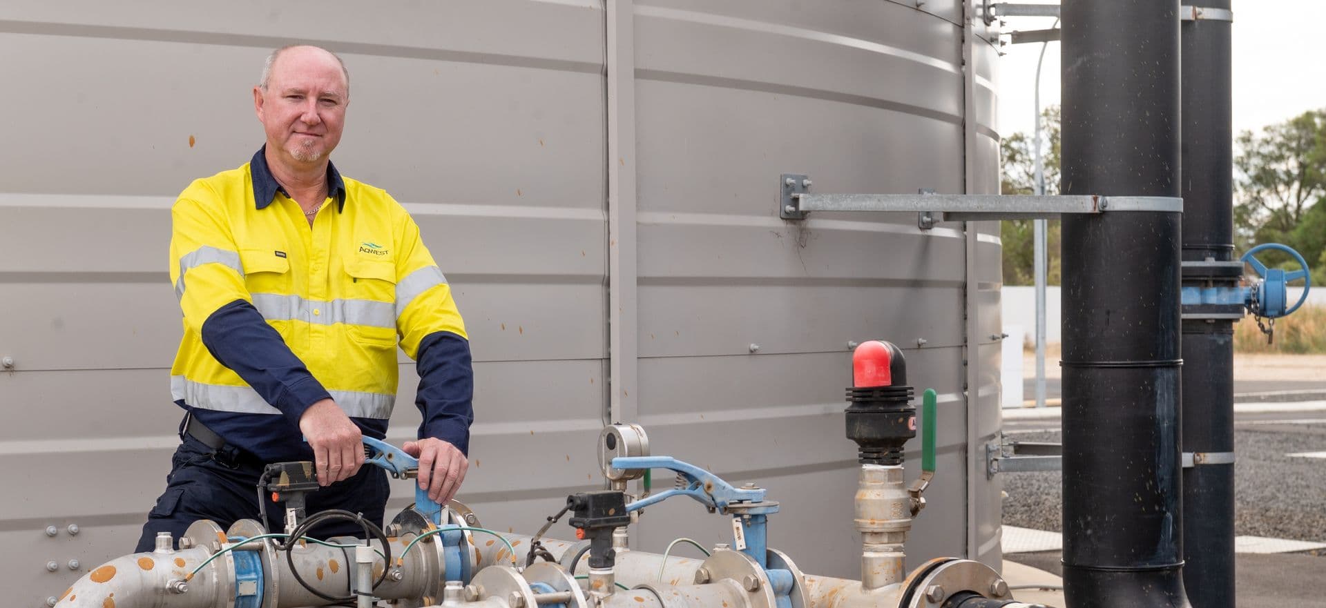 Person adjusting water pipes